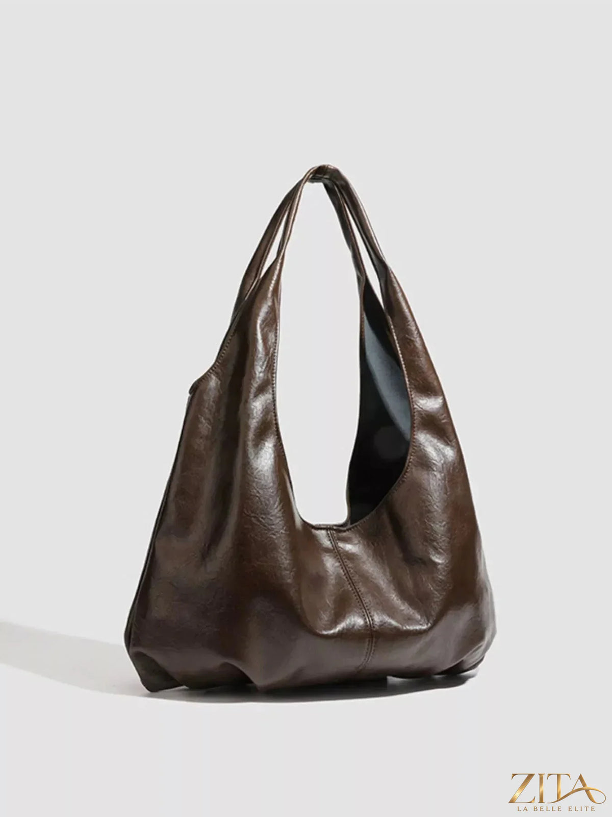 Vintage glossy hobo shoulder bag with matching pouch by Zita La Belle Elite, featuring a sleek design and elegant finish.