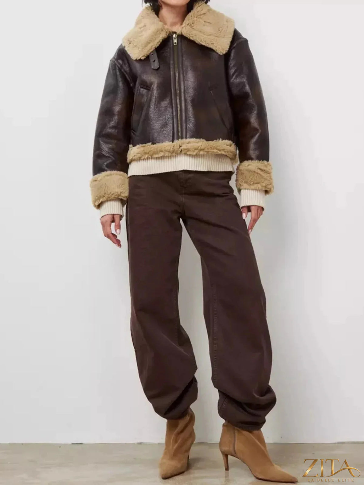 Vintage-inspired faux leather aviator jacket with plush shearling trim by Zita La Belle Elite, featuring classic design and warm details.