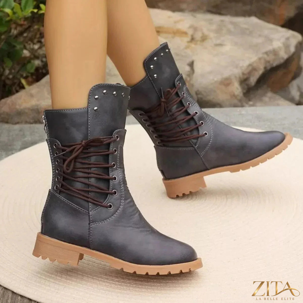 Black studded lace-up boots by Trendsi featuring metal studs, chunky soles, and high ankle support.