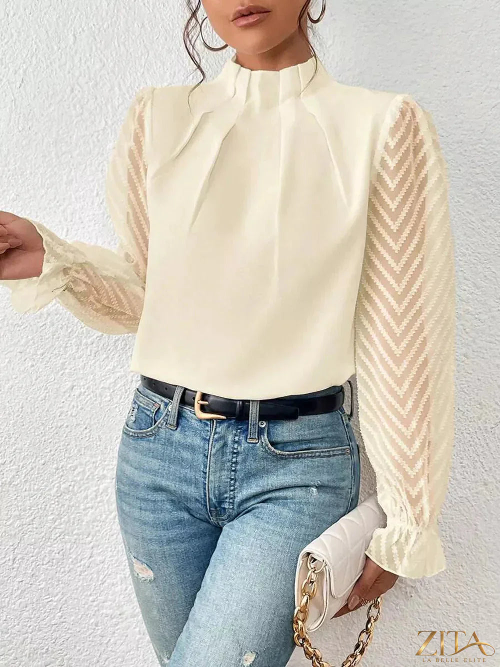 Zita La Belle Elite mock neck blouse with flounce sleeves, featuring a stylish and feminine design in a close-up image.