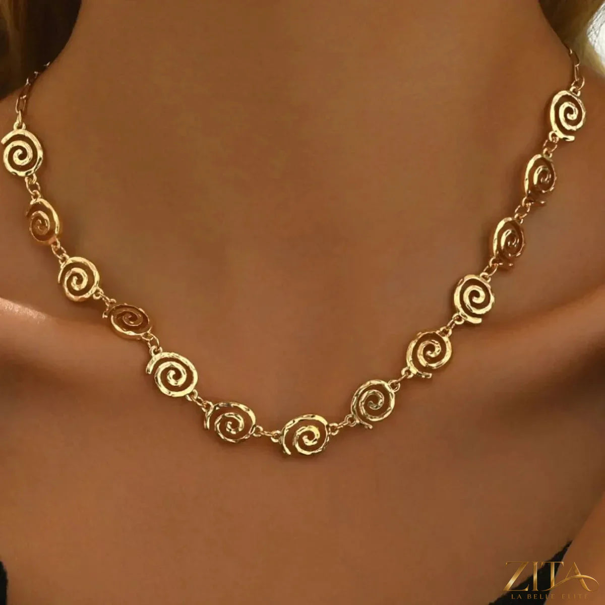 18K gold-plated spiral necklace and bracelet jewelry set with matching designs, featuring sleek, modern spiral patterns.