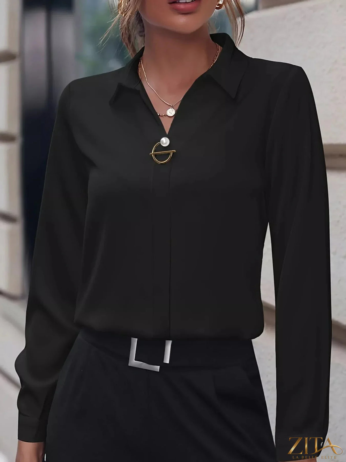 Zita La Belle Elite long sleeve satin blouse in elegant fabric, displayed on a hanger with a smooth, shiny finish.