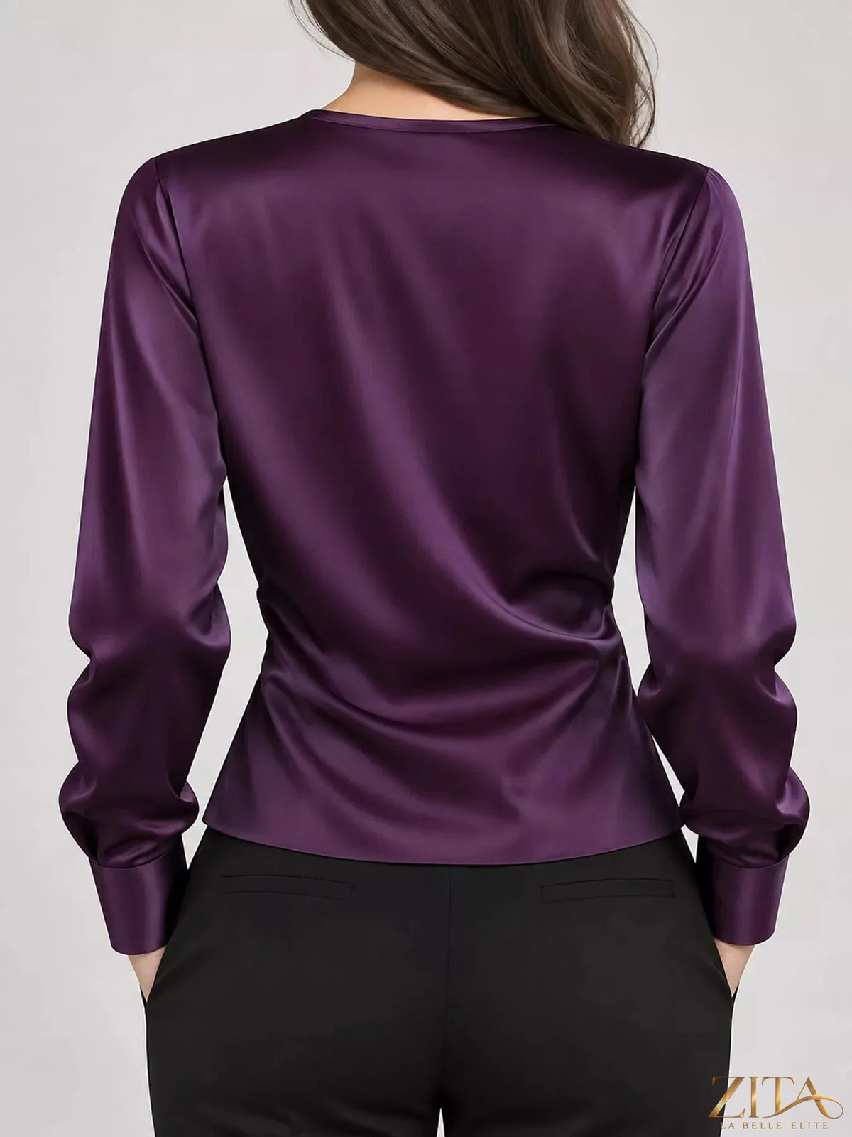 Zita La Belle Elite satin surplice long sleeve blouse with deep V neckline and elegant draping, shown in a sleek, silky fabric.