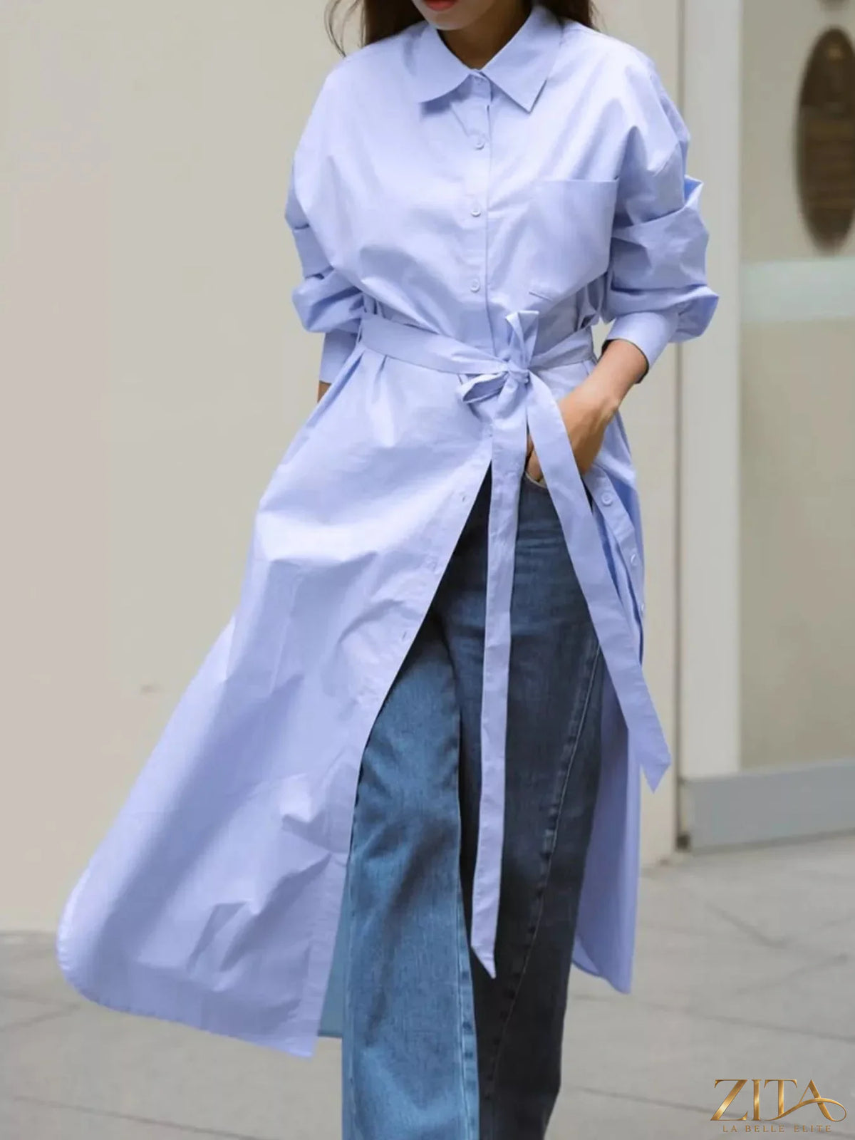 Longline button-down shirt by Zita La Belle Elite, featuring a relaxed fit and classic collar, shown in a neutral fabric.