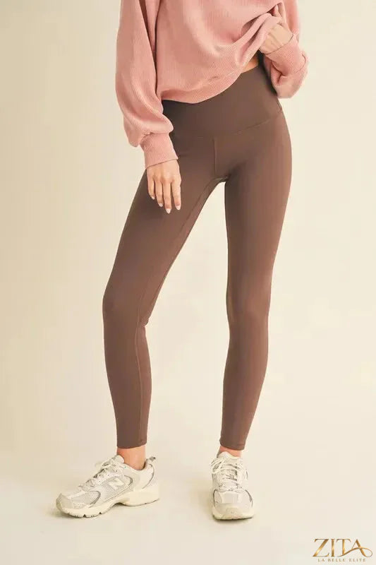 Yelete high waisted fleece-lined leggings in black, showing the snug waistband and soft, cozy fleece interior for winter wear.