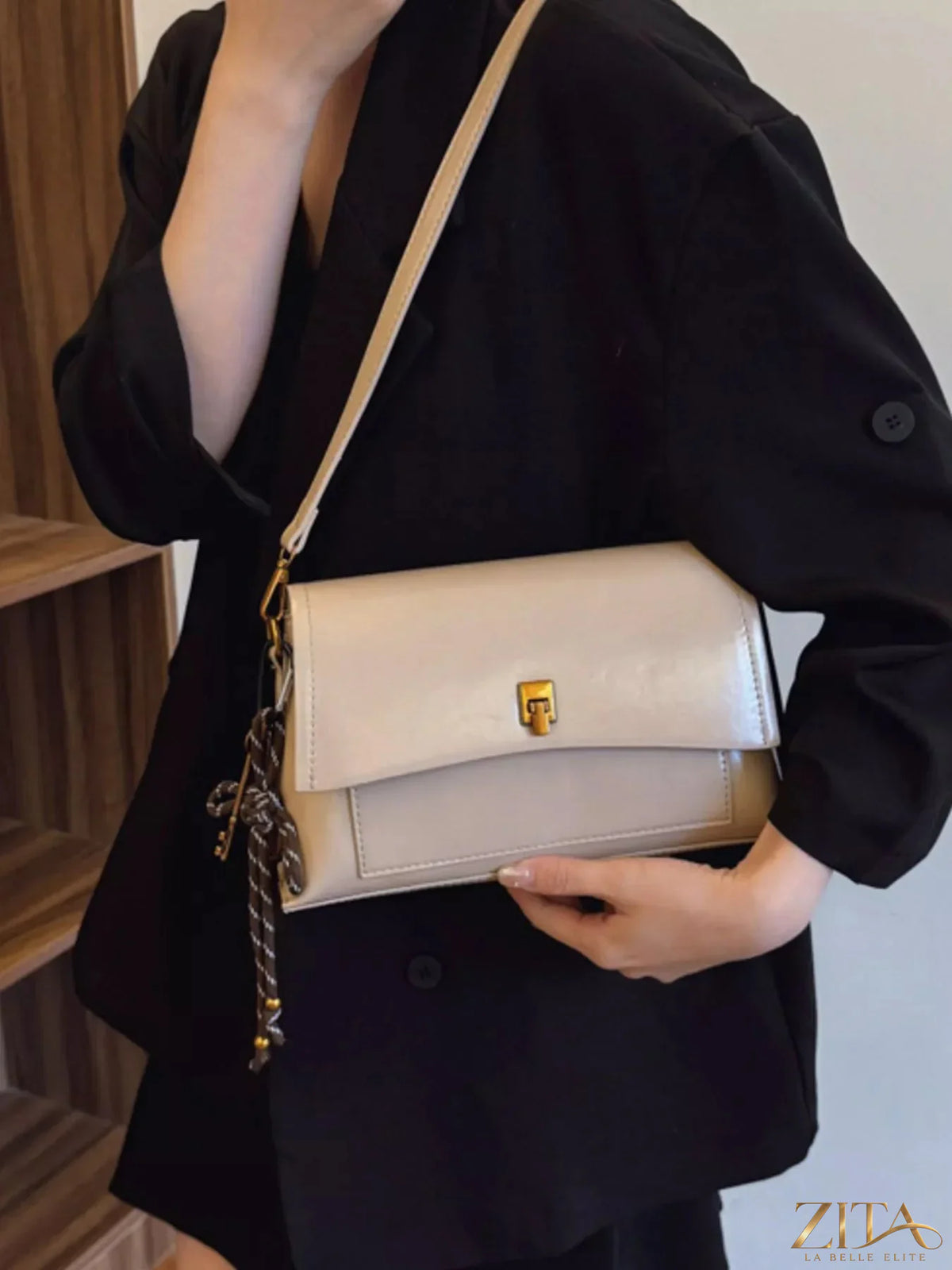 Leather flap shoulder bag by Trendsi showing its stylish design, adjustable strap, and textured leather surface.