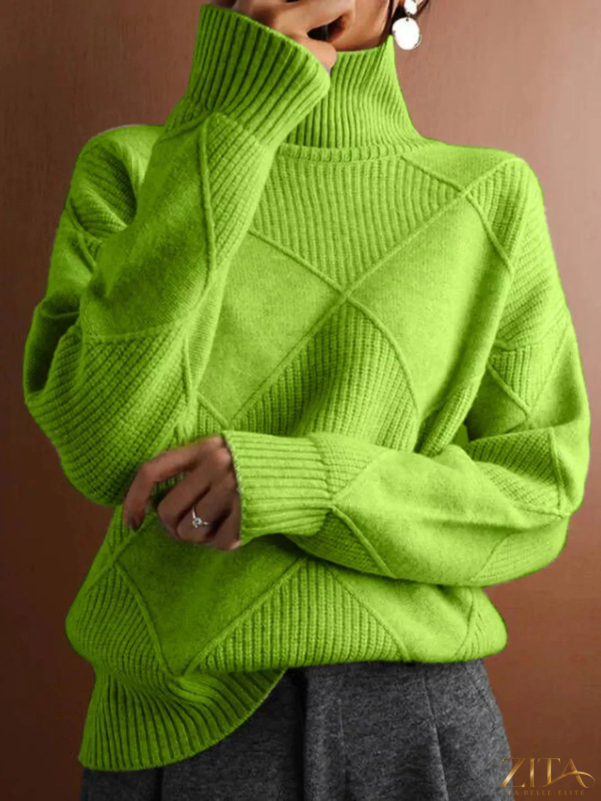 Zita La Belle Elite argyle pattern turtleneck sweater in cozy knit with colorful diamond design, close-up view.