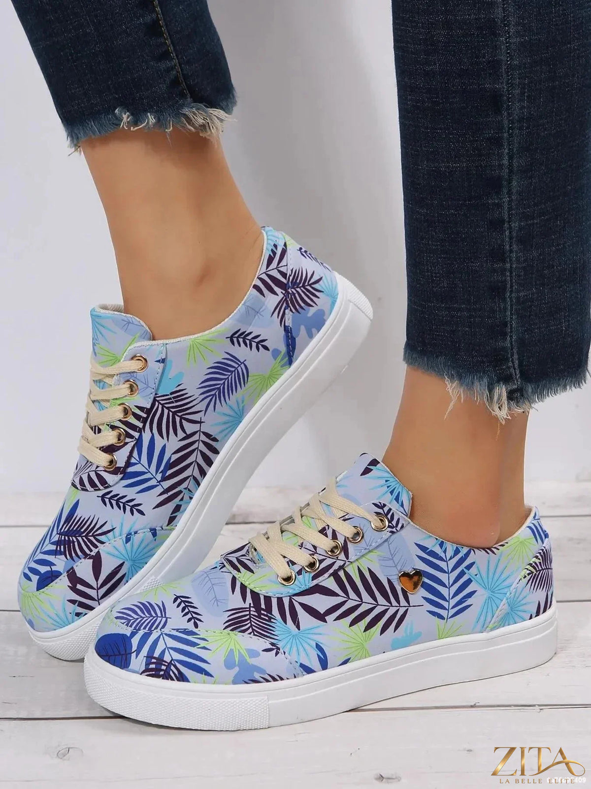 Tropical leaf print canvas sneakers by Zita La Belle Elite featuring vibrant green and blue leaf designs on casual footwear