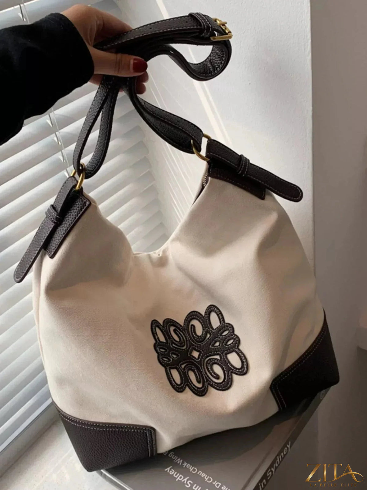 Embroidered canvas tote bag by Zita La Belle Elite with colorful floral embroidery and spacious interior.