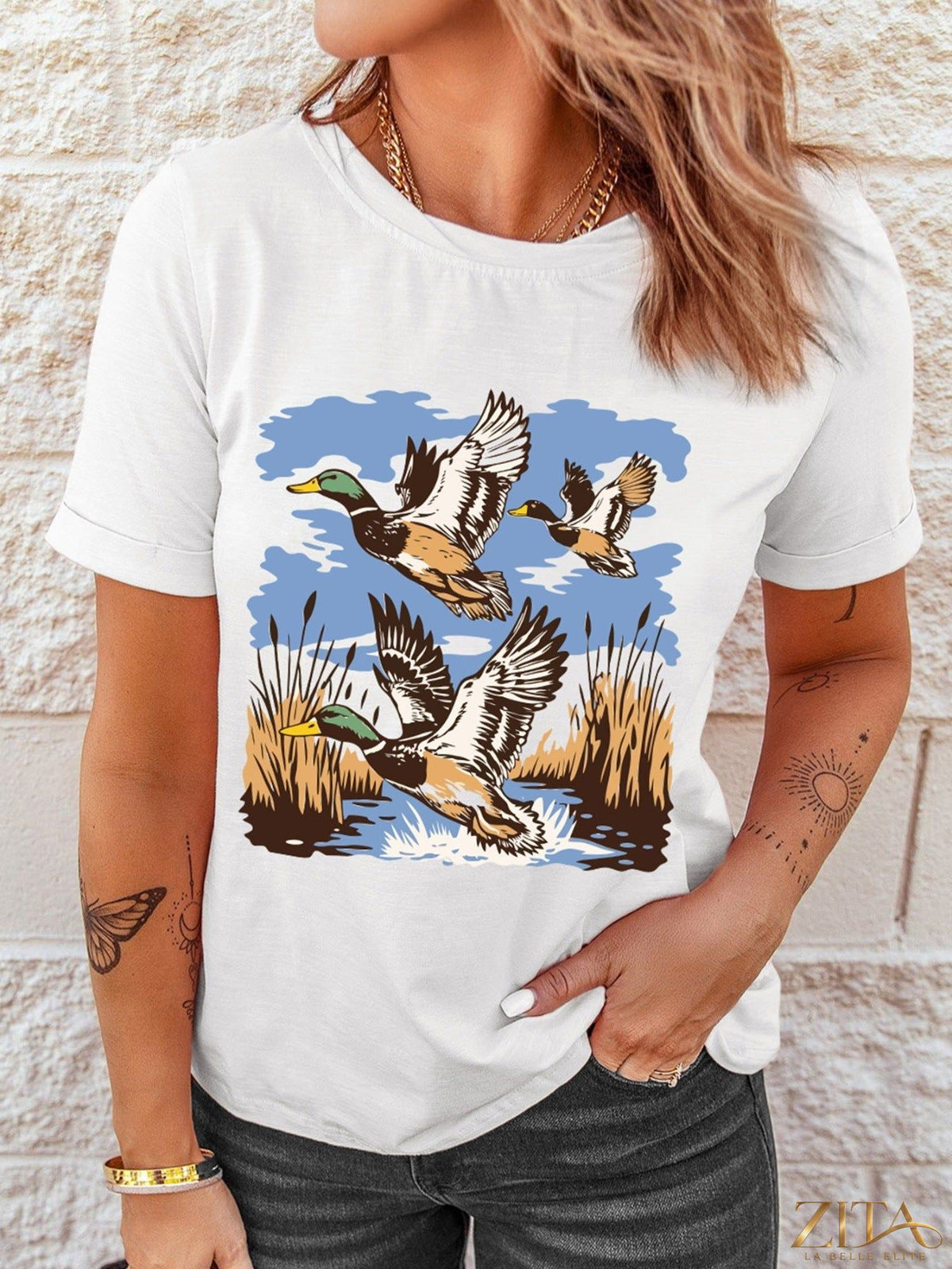 Wild Duck graphic round neck T-shirt by Trendsi featuring a detailed duck illustration on soft fabric.