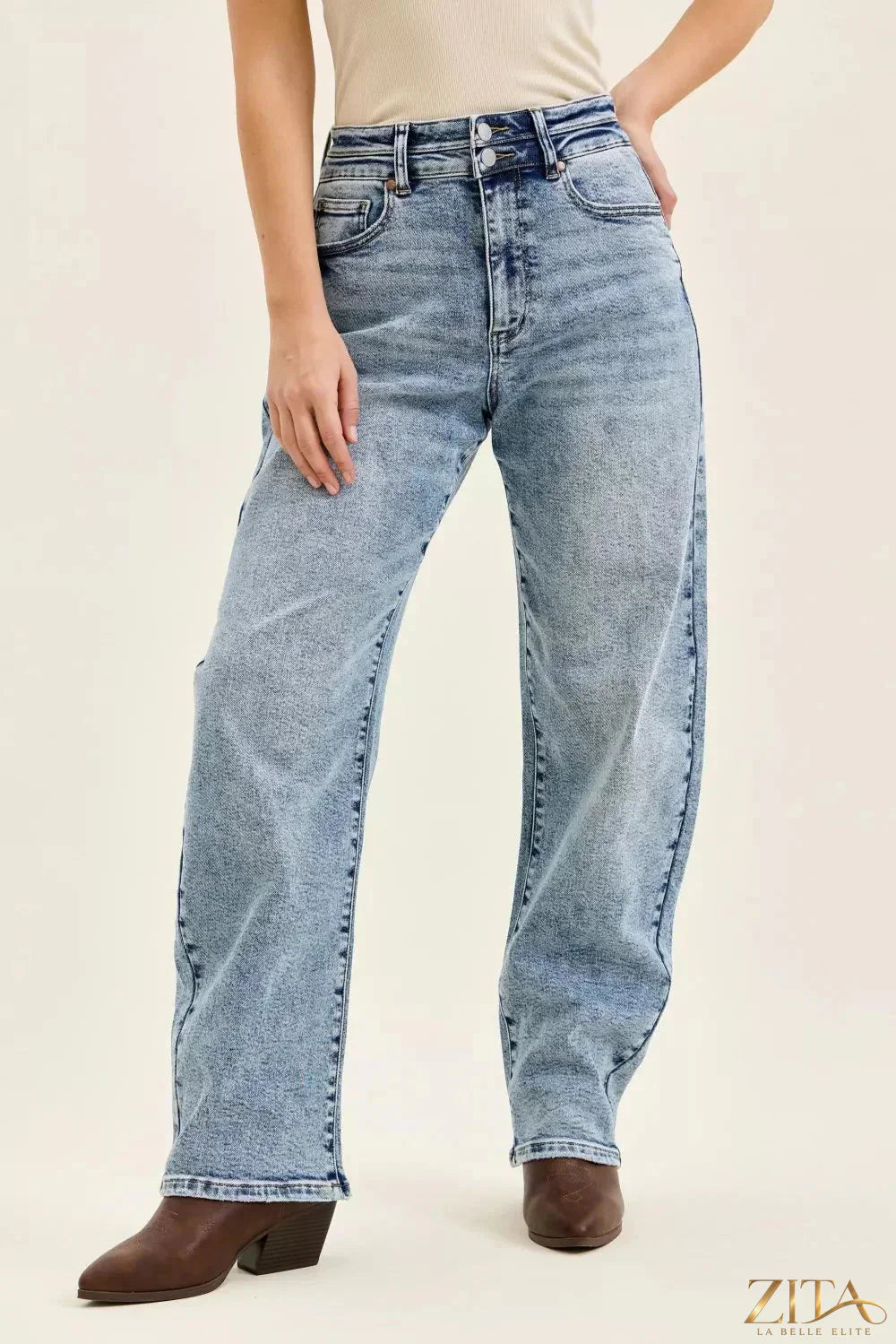 Judy Blue Marlow Arc Leg jeans with double waistband and distressed details, styled on a model showcasing the trendy denim design.