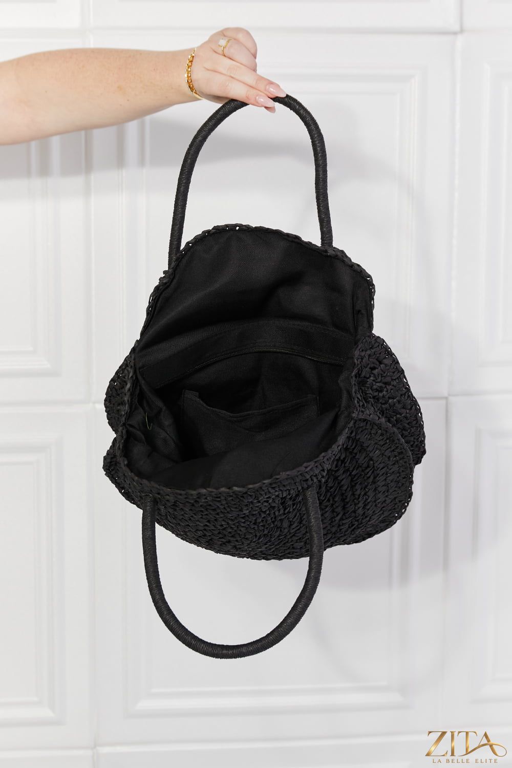 Justin Taylor Beach Date Straw Rattan Handbag in black with woven design and top handle, stylish for summer beach outings.