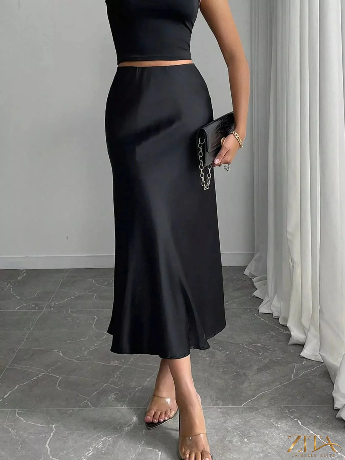 Satin midi skirt from Trendsi featuring a smooth, shiny fabric, high waist, and elegant flow, perfect for stylish outfits.