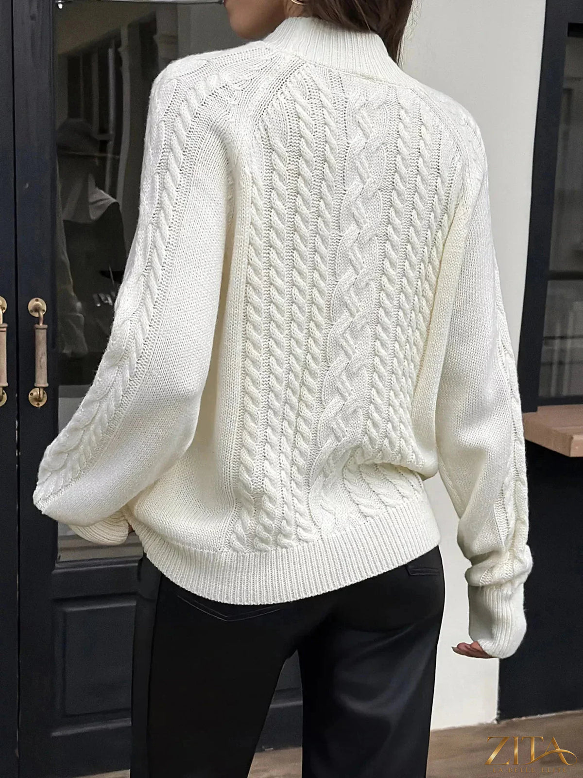 Zita La Belle Elite mock neck cable-knit sweater in cozy cream with textured knit pattern and ribbed cuffs and hem.