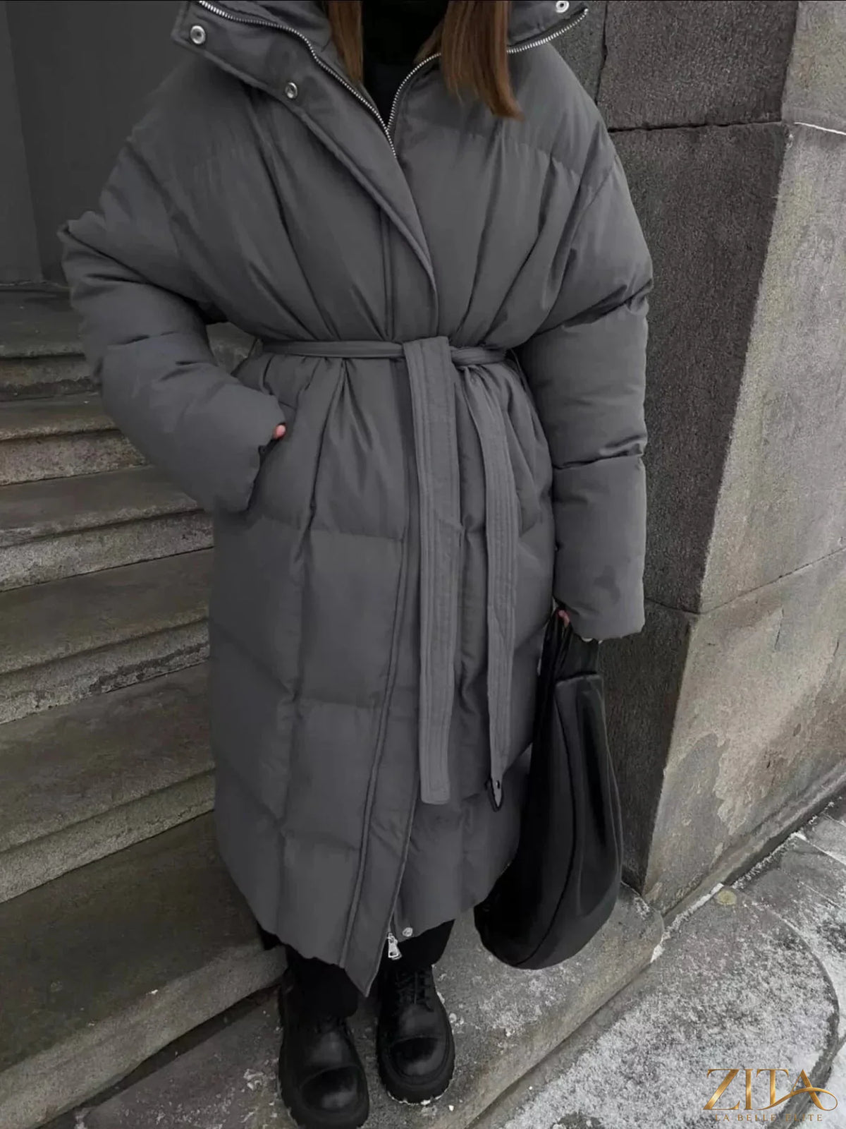 Longline padded winter coat with belt from Zita La Belle Elite, featuring a warm, quilted design and stylish belt detail.