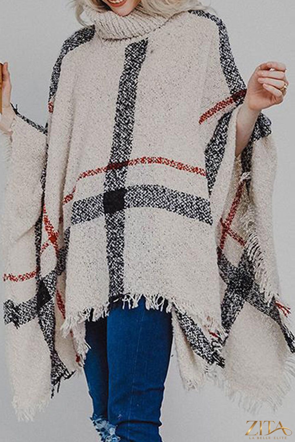 Plaid turtleneck raw hem poncho by Trendsi, featuring a cozy plaid pattern and stylish raw hem detail, perfect for fall fashion.