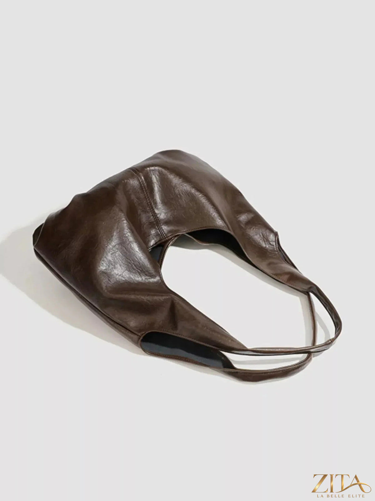 Vintage glossy hobo shoulder bag with matching pouch by Zita La Belle Elite, featuring a sleek, stylish design in rich leather.
