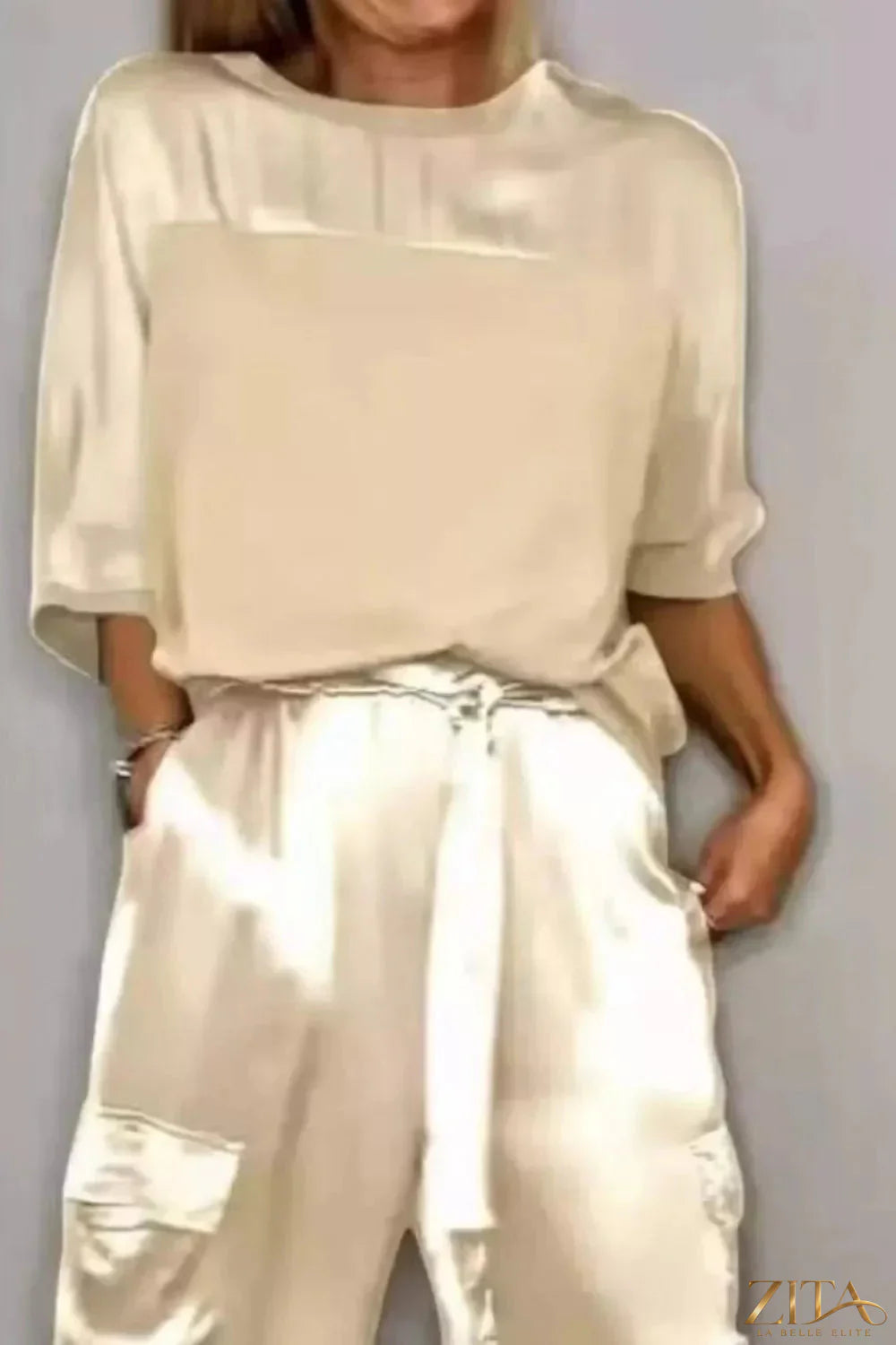 Satin round neck top and matching pants set in a soft, shiny fabric, designed for a chic and comfortable look.