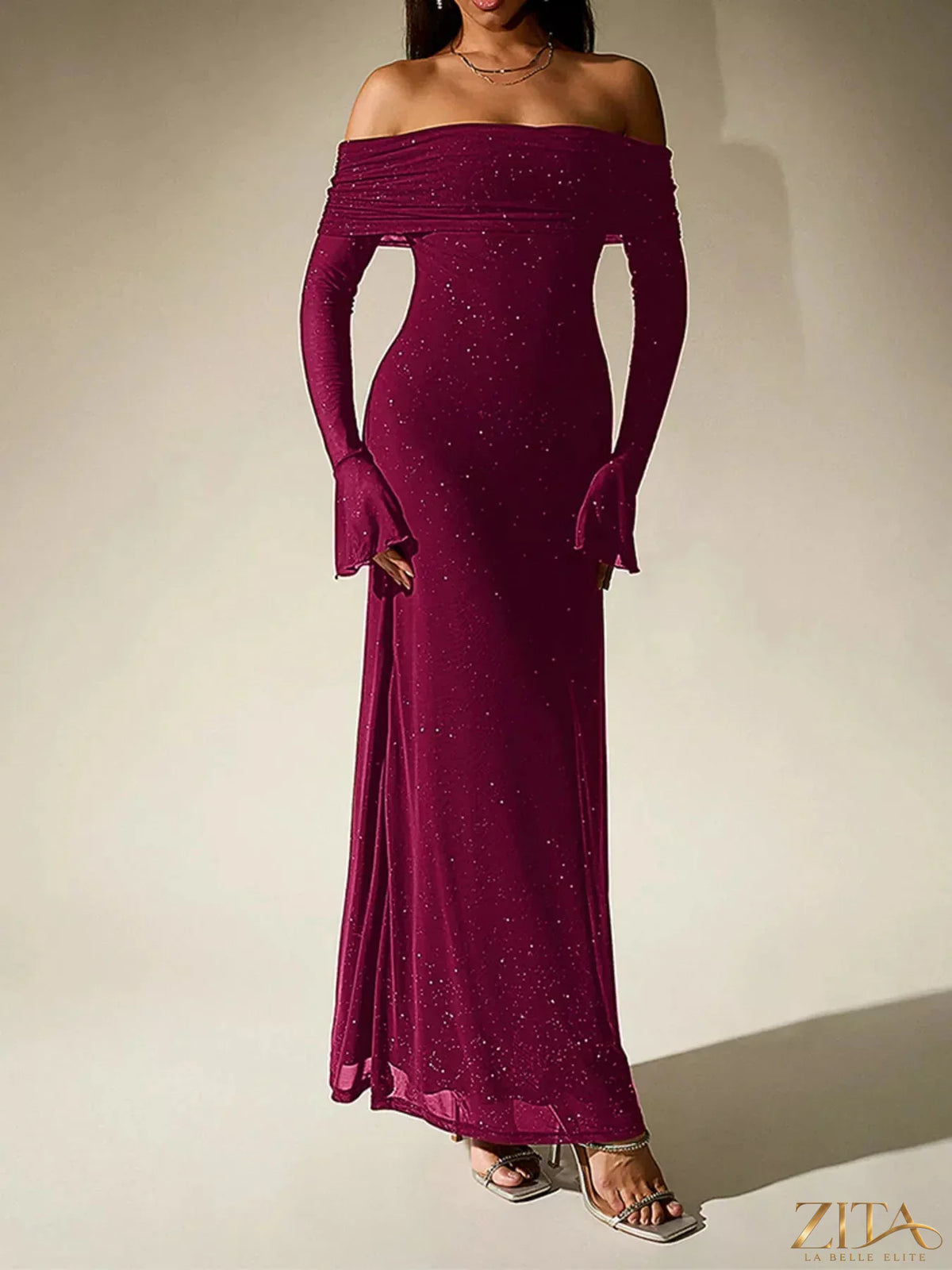 Zita La Belle Elite glitter off-shoulder maxi dress with flowing fabric and shimmering details, elegant evening wear for women.