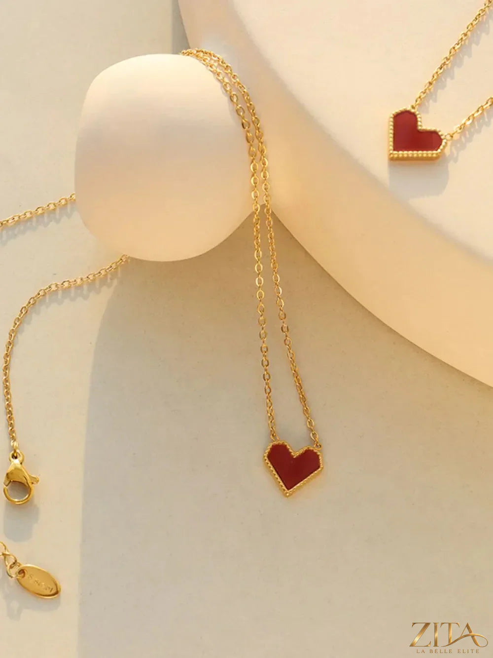Titanium steel heart necklace by Zita La Belle Elite featuring a sleek, polished heart pendant on a delicate chain.