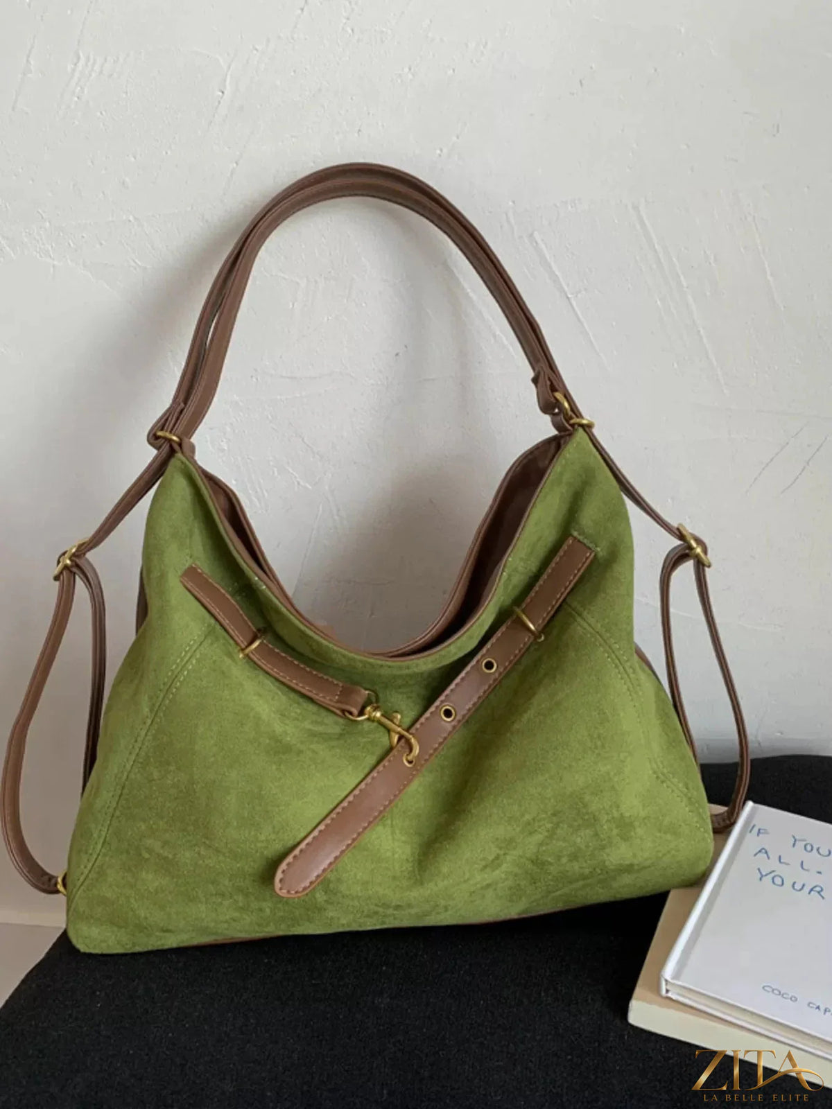 Zita La Belle Elite adjustable strap handbag with decorative charm featuring sleek design and stylish details.