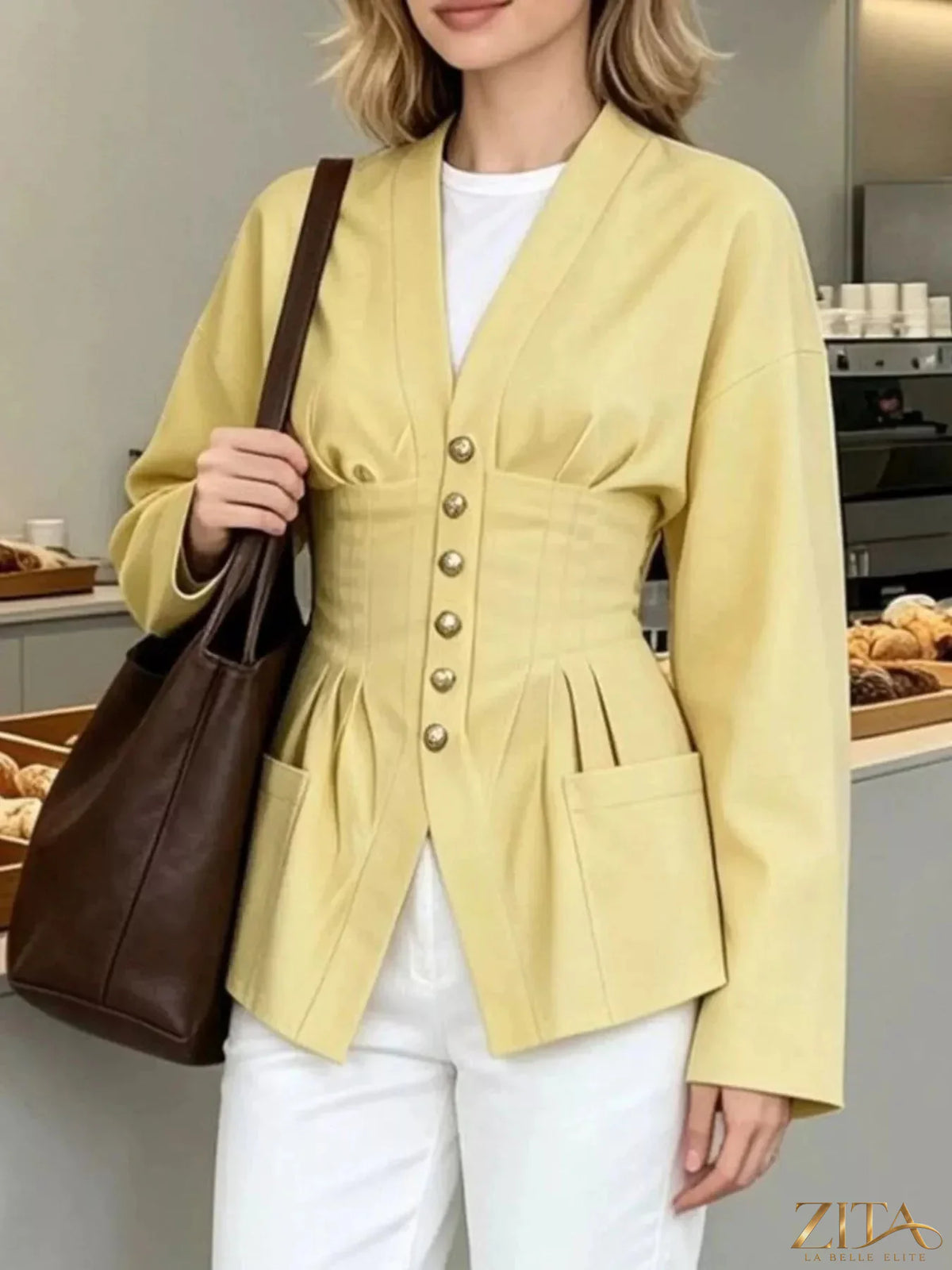 Zita La Belle Elite pleated waist blouse with button detail, featuring a stylish and elegant design with a fitted silhouette.