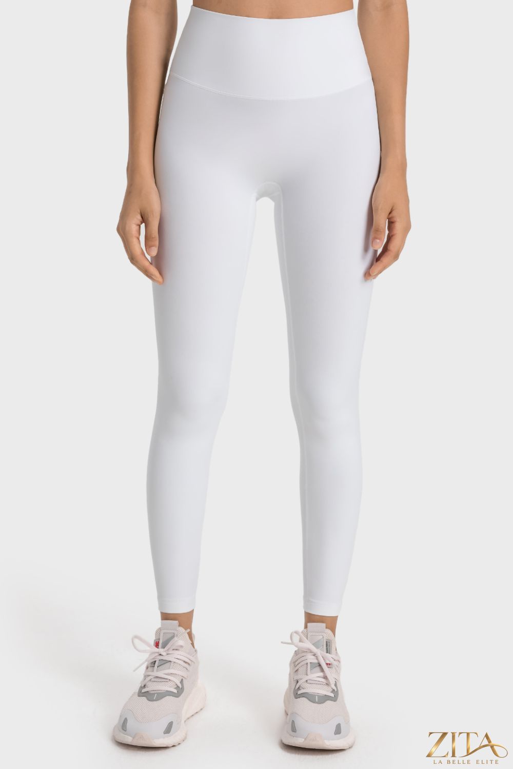 Millennia high-rise wide waistband yoga leggings by Trendsi featuring a sleek black design and comfortable stretch fabric.