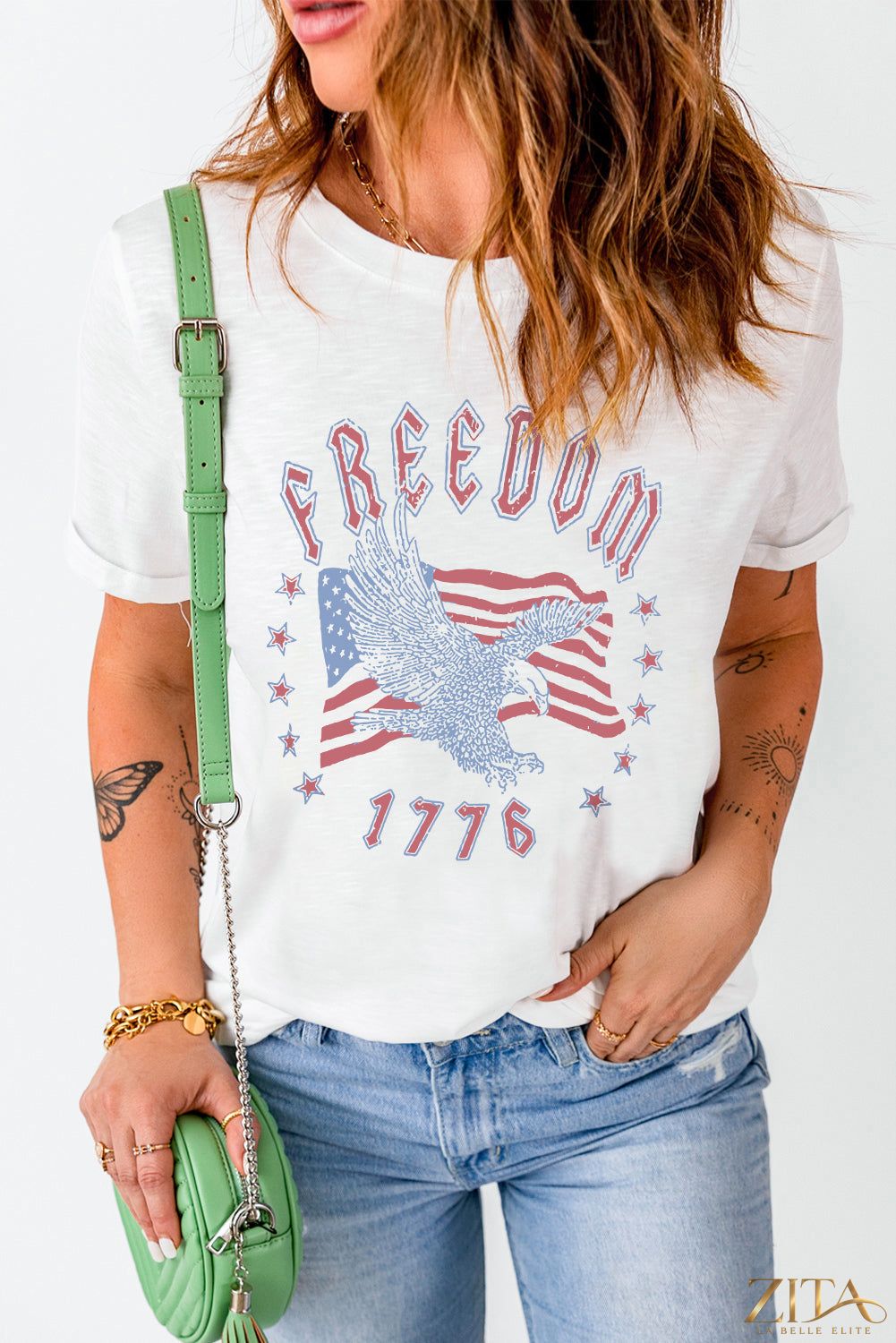 Black Freedom 1776 graphic T-shirt by Trendsi featuring patriotic design and casual fit, displayed on a hanger.