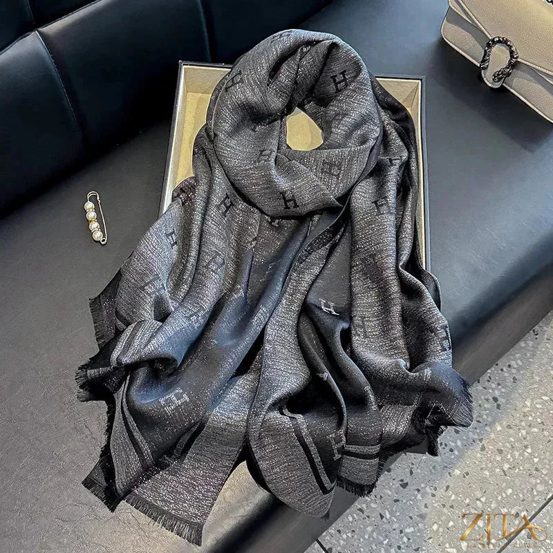 Raw hem scarf by Trendsi featuring lightweight fabric and fringed edges, styled as a versatile fashion accessory.