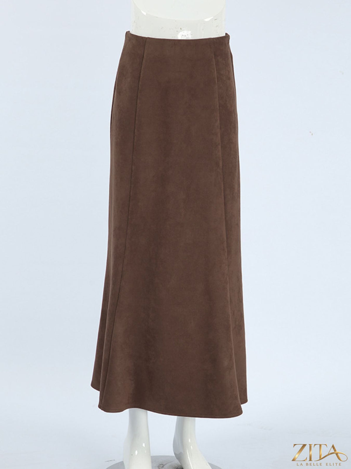 Trendsi suede midi skirt in soft tan, flowing design with a high waist and midi length, styled for a chic look.