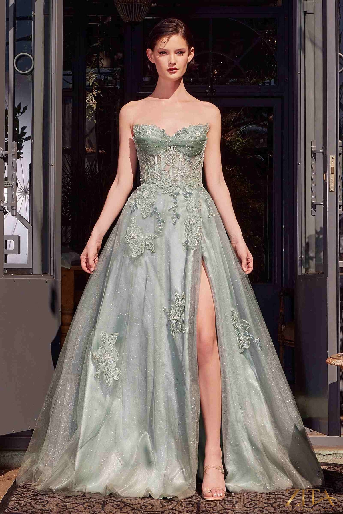Elegant strapless layered tulle ball gown by Zita La Belle Elite featuring a flowing skirt and intricate detailing.
