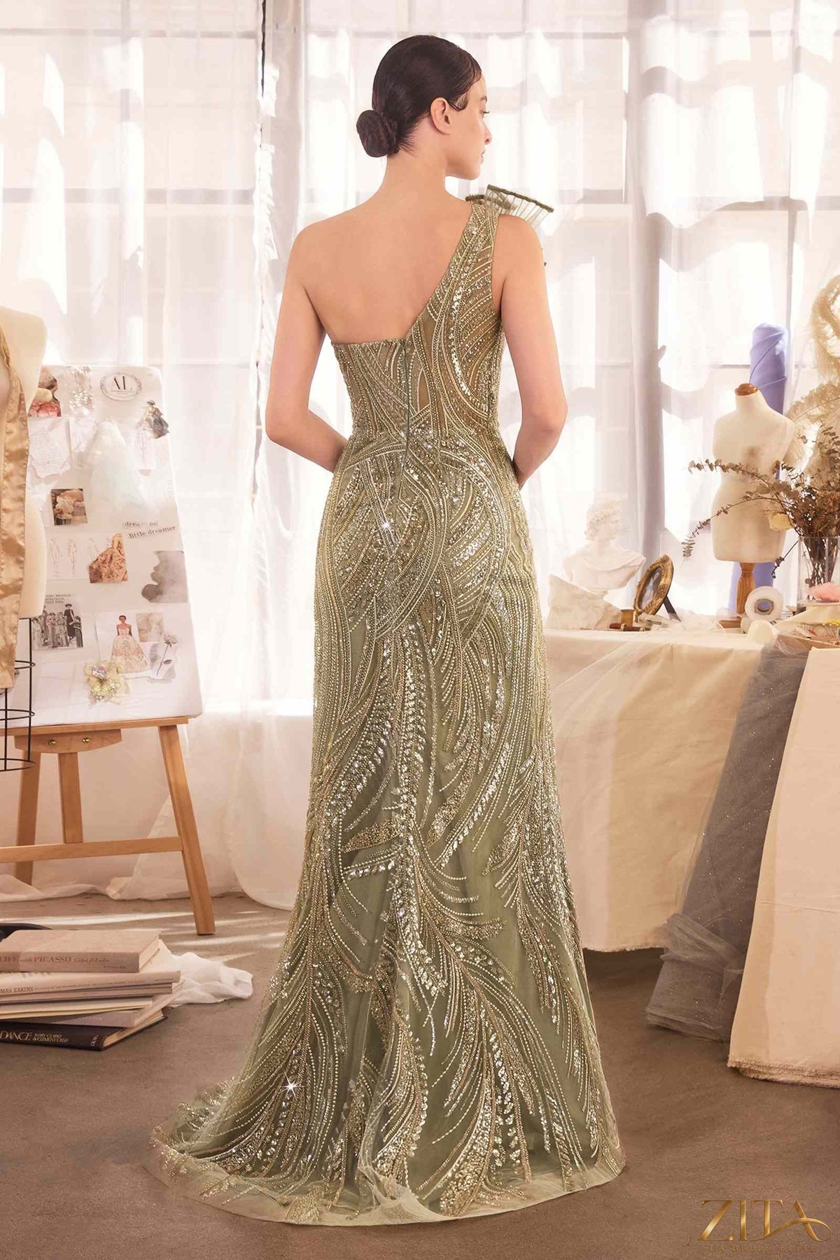 Beaded one shoulder evening gown from Zita La Belle Elite, featuring elegant draping and intricate beadwork on a formal dress.