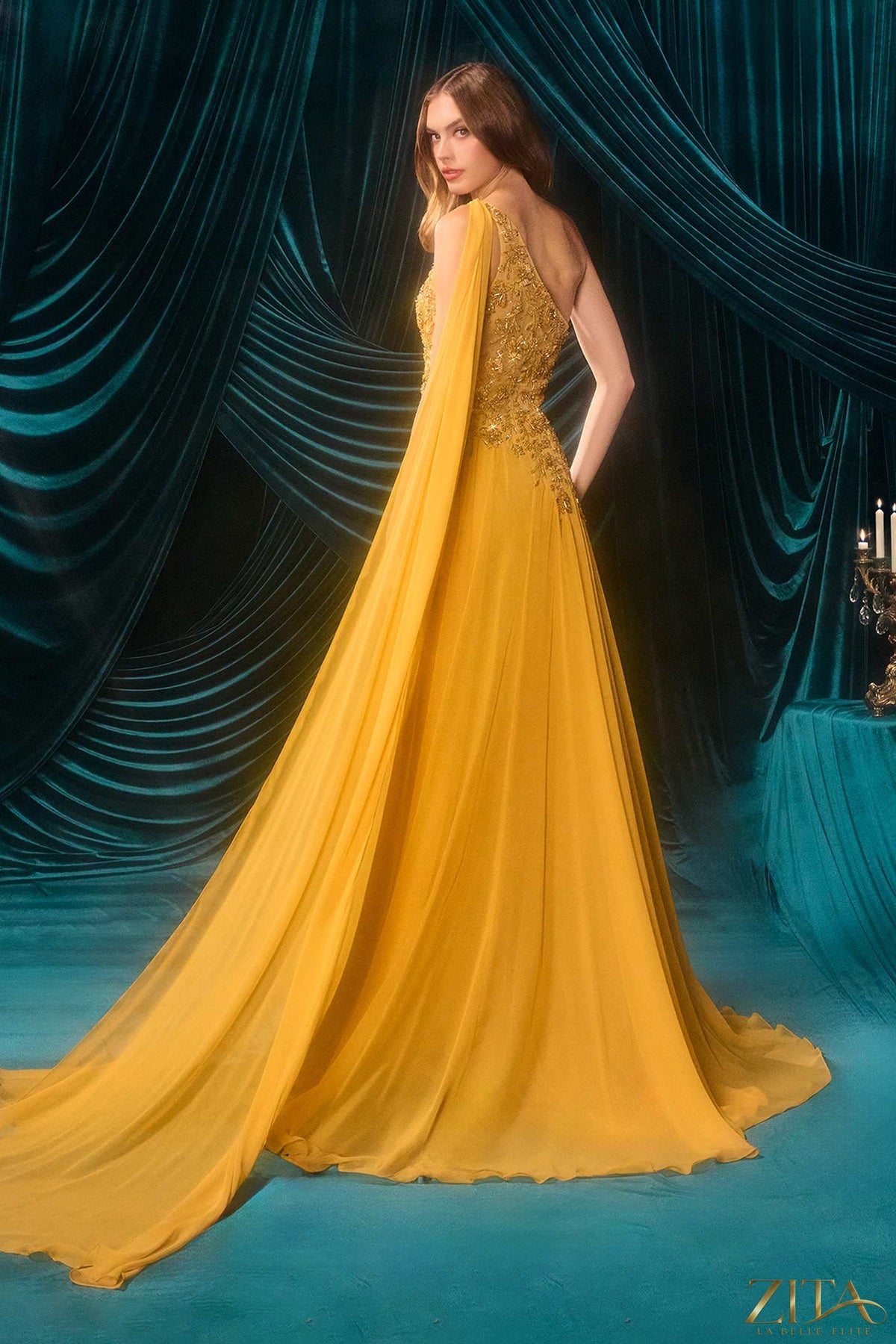 Marigold one-shoulder chiffon A-line formal dress by Zita La Belle Elite, shown from the back with flowing fabric and elegant design.