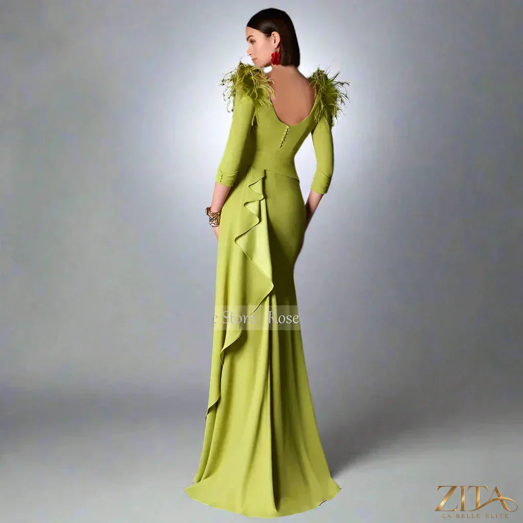 Women’s satin evening dress with feather ruffles, button details, and a long, elegant silhouette by Zita La Belle Elite.