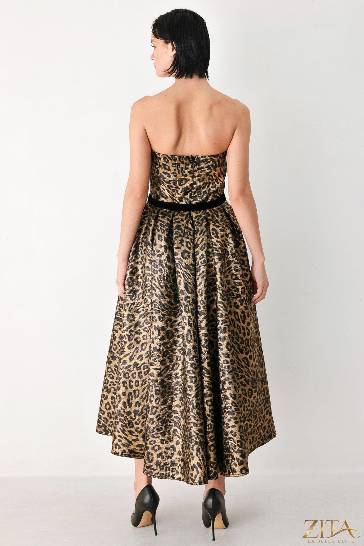 Zita La Belle Elite Wildly Golden Leopard strapless midi dress with black accents, showcasing its fitted bodice and stylish design.