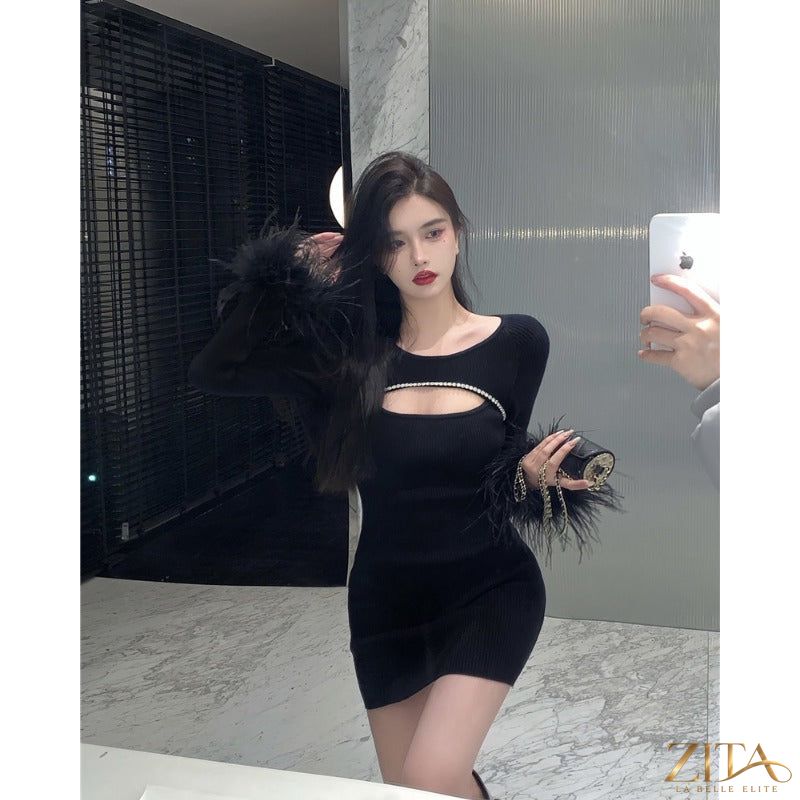 Black party dress with ostrich feather detail from Zita La Belle Elite, featuring elegant fabric and stylish design for women.
