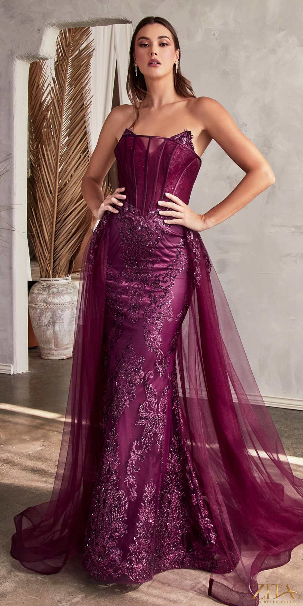 Cinderella Divine J858 strapless glitter mermaid gown in French plum, designed by Zita La Belle Elite, showcased on a model.
