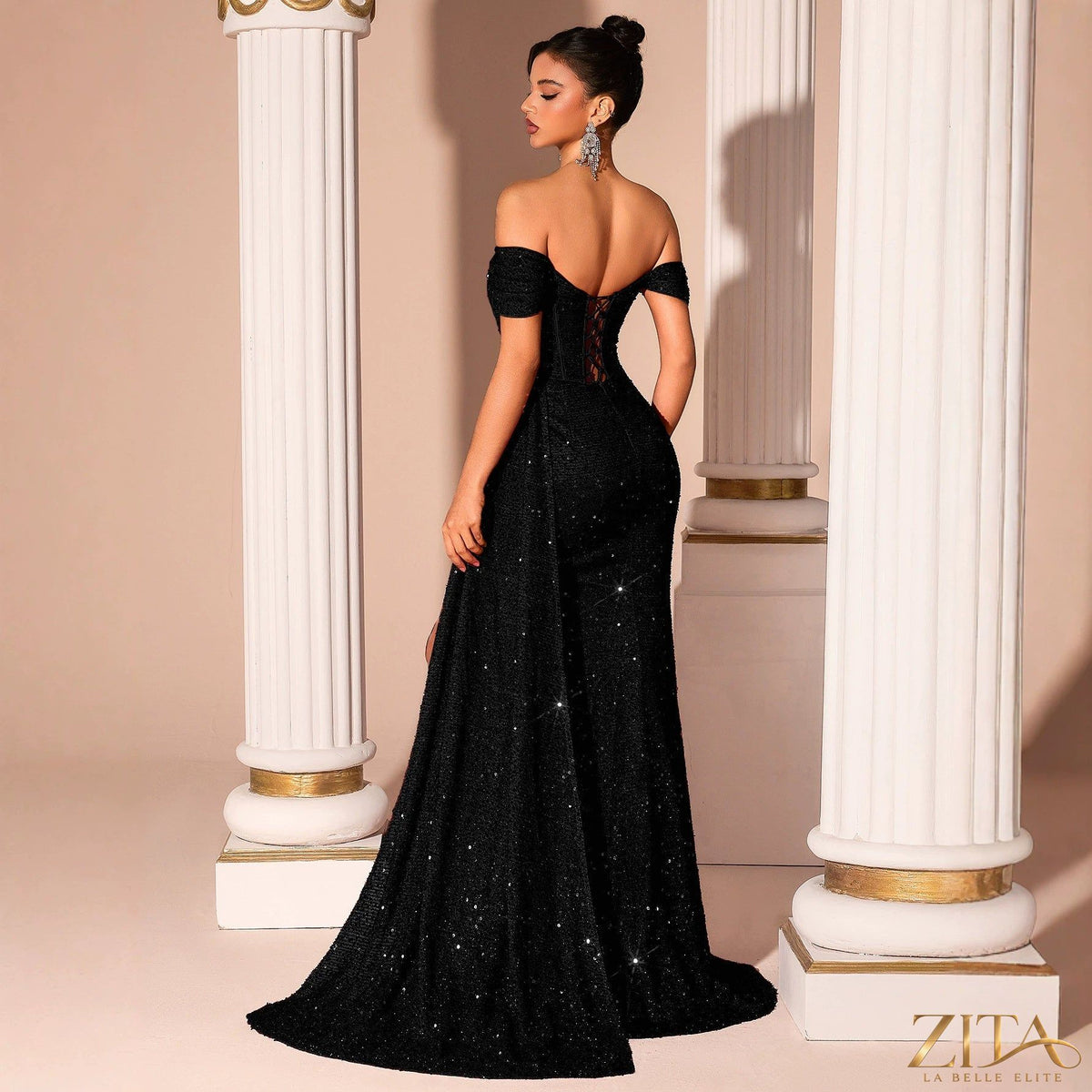 Black sequin strapless fishtail evening dress by Zita La Belle Elite, featuring a fitted bodice and flowing skirt.