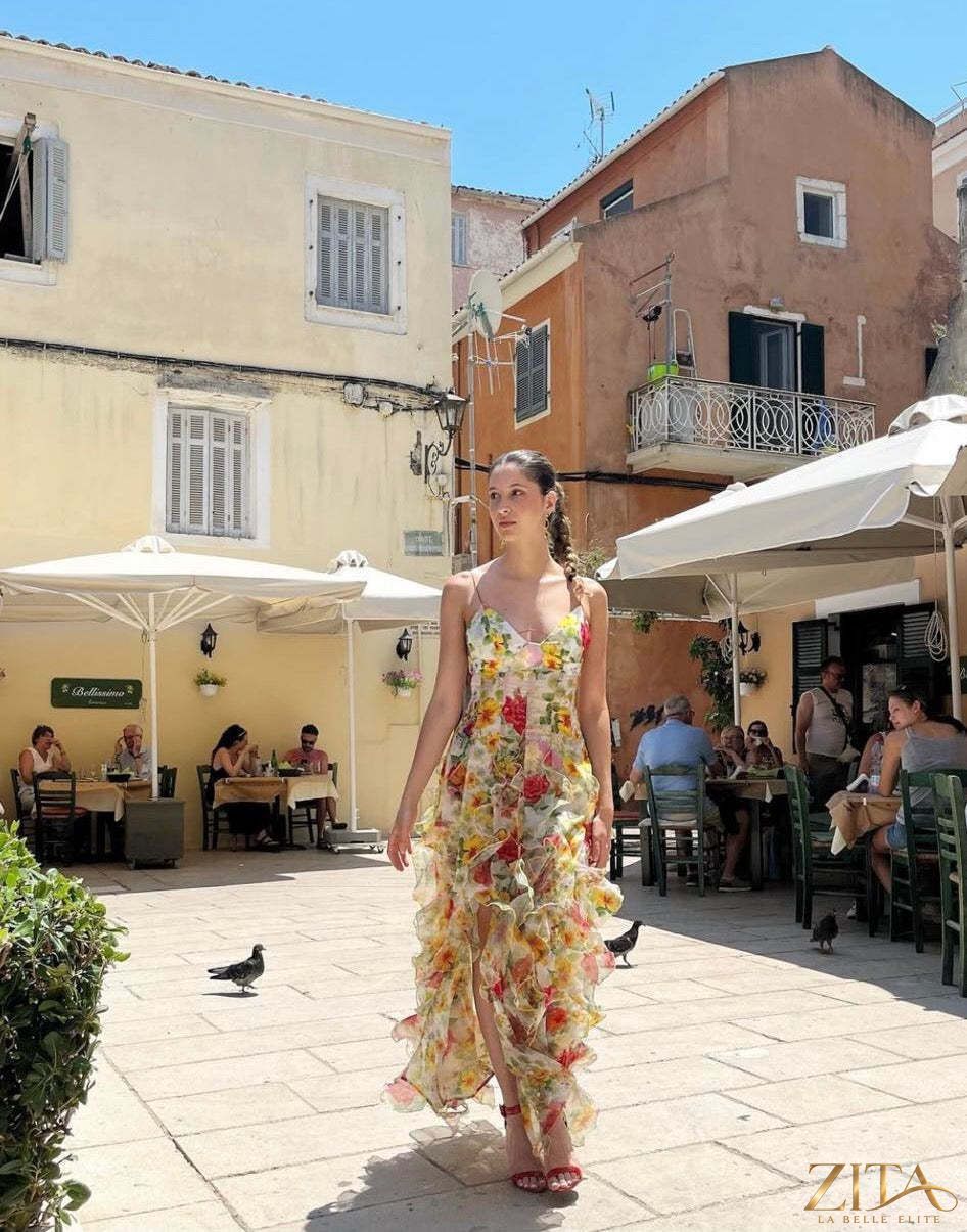 Elegant off-the-shoulder printed chiffon evening gown by Zita La Belle Elite, featuring flowing fabric and stylish design.