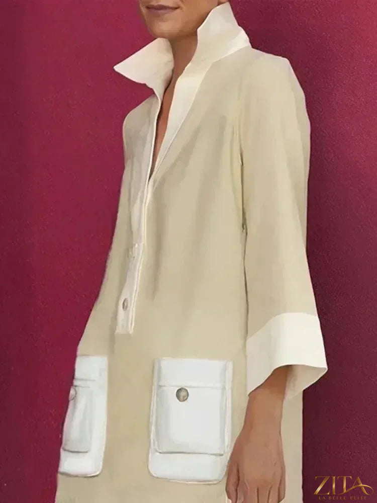 Zita La Belle Elite contrast color button-down shirt mini dress in black and white with long sleeves and a fitted silhouette.