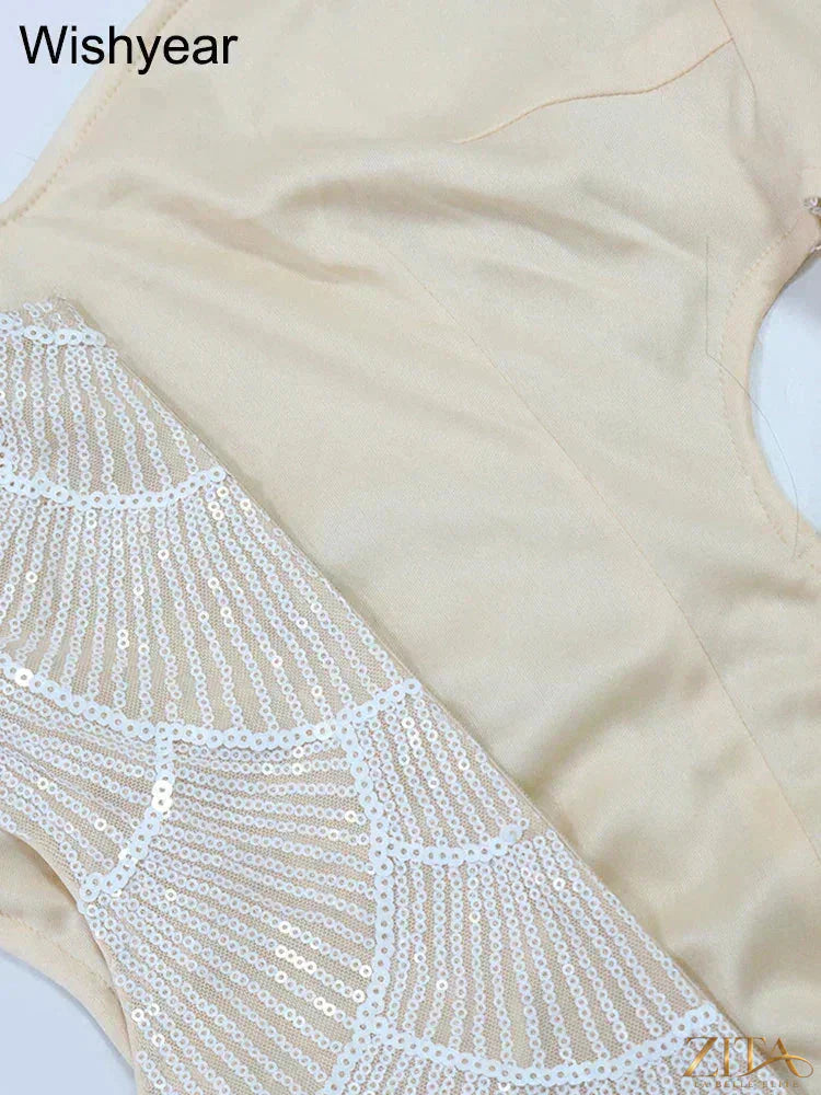 Elegant women's mermaid evening gown by Zita La Belle Elite featuring sequins, hollow-out design, spaghetti straps, and a backless style
