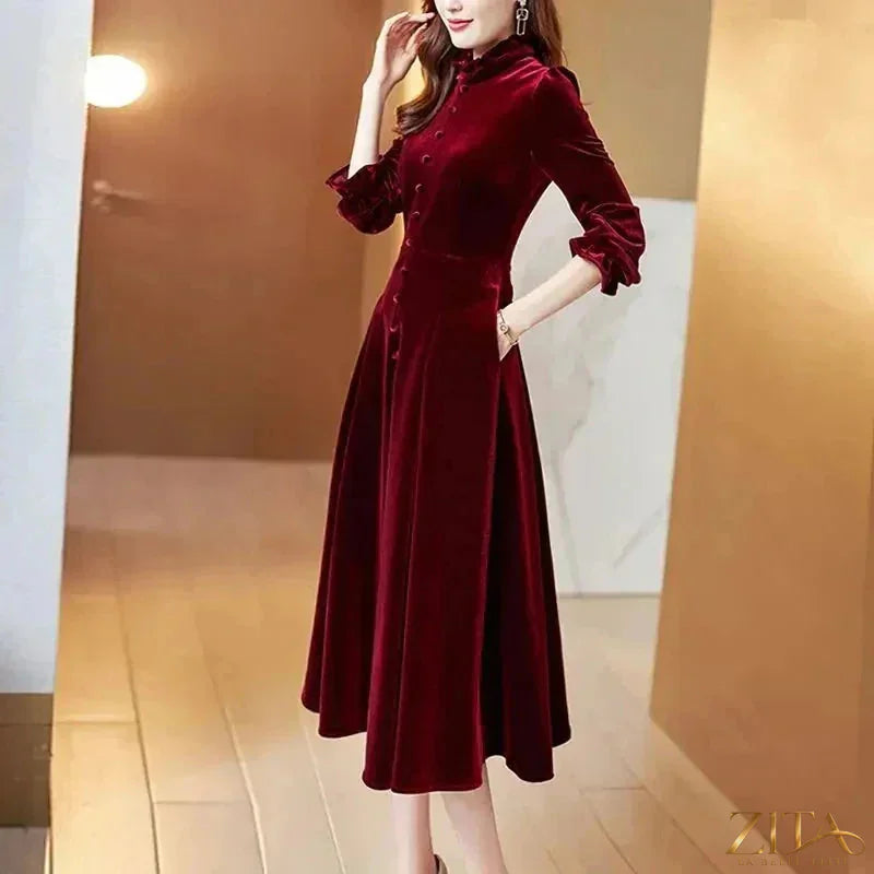 Wine red velvet women’s maxi dress with long sleeves by Zita La Belle Elite, flowing and elegant for special occasions.