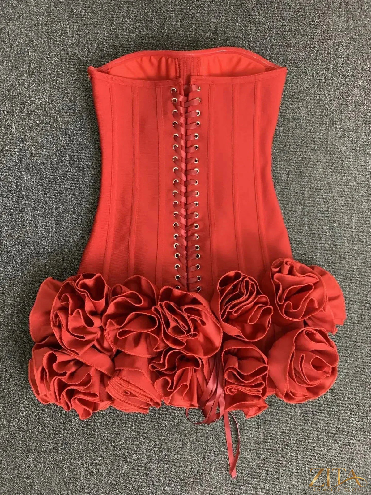 Zita La Belle Elite strapless lace-up back bodycon mini dress featuring lace details and a fitted silhouette for party wear.