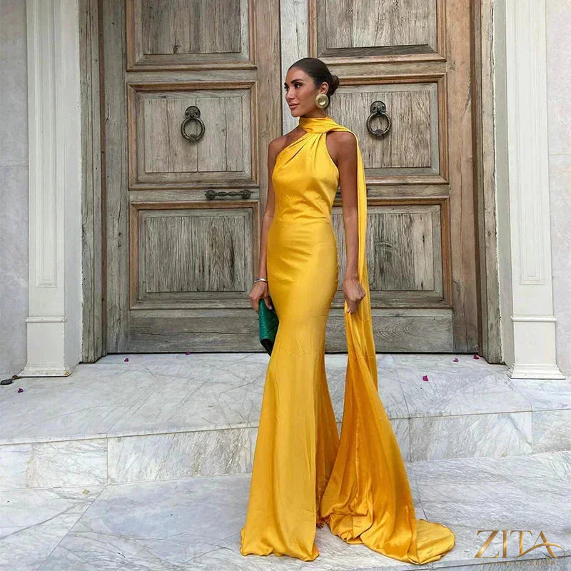Backless lace-up maxi dress by Zita La Belle Elite featuring a sleeveless ribbon design, perfect for elegant evening or party wear.