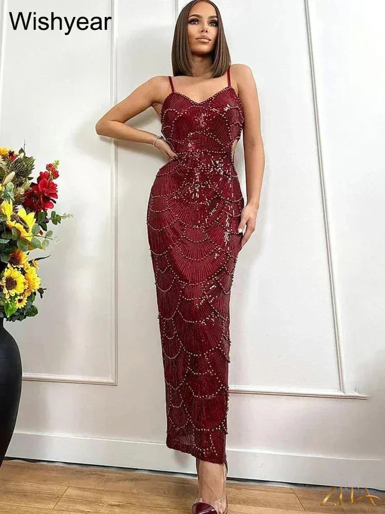 Elegant sequin backless mermaid evening gown with spaghetti straps by Zita La Belle Elite, showcasing a fitted, glamorous silhouette.