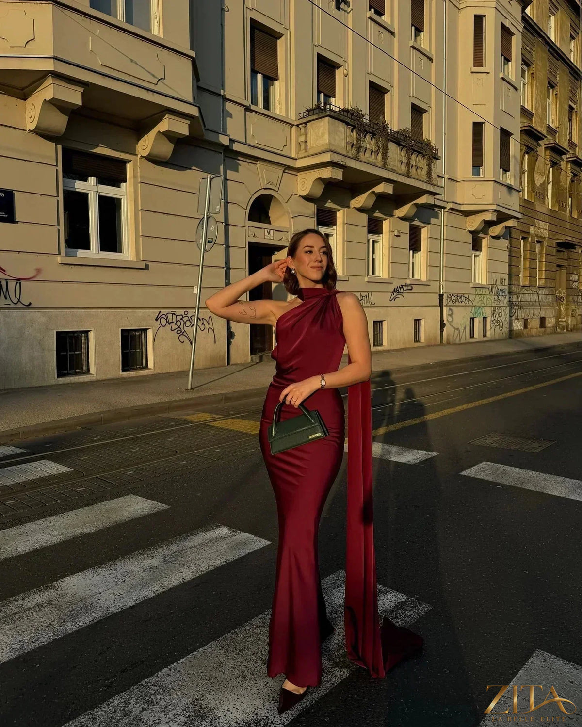 Backless lace-up maxi dress by Zita La Belle Elite featuring a sleeveless design and elegant ribbon details, perfect for evening parties.