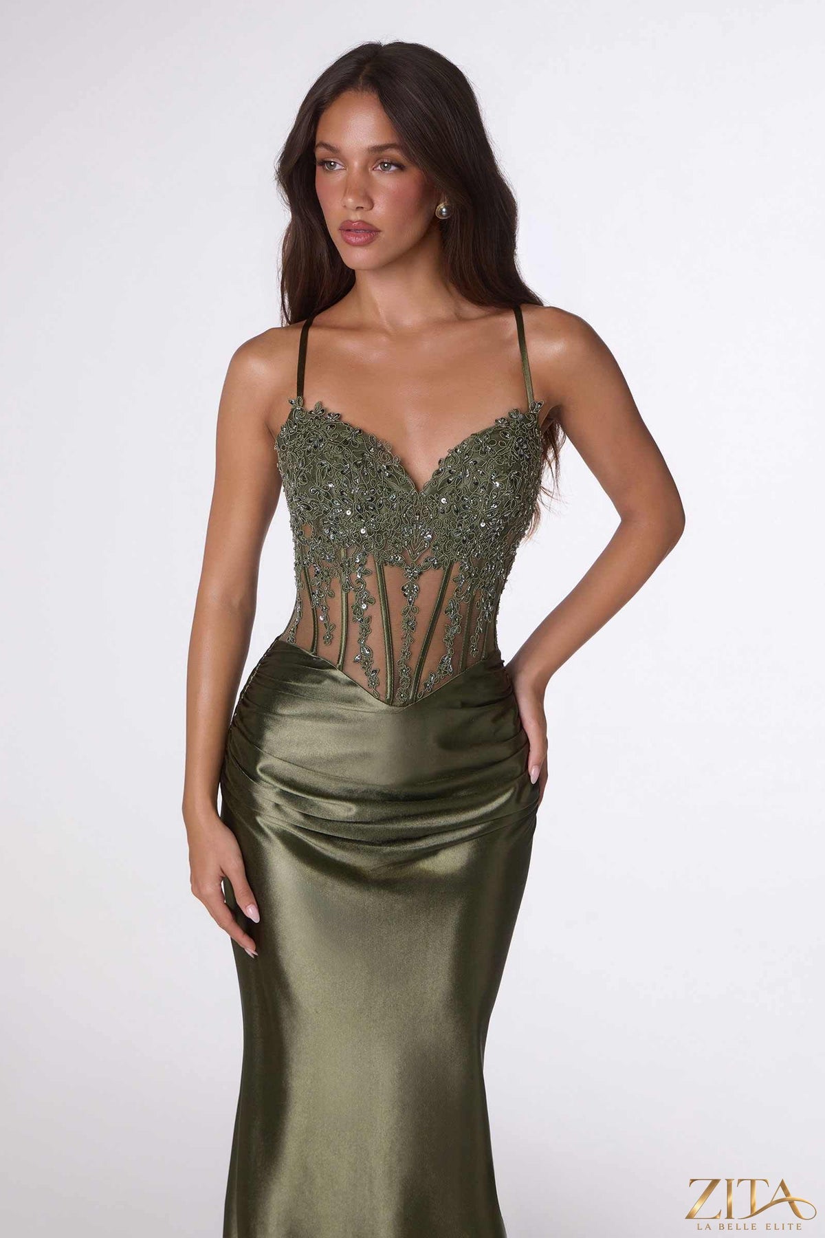 Olive green fitted satin sheer corset mermaid gown by Zita La Belle Elite, showcasing a sleek, elegant dress with a mermaid silhouette.