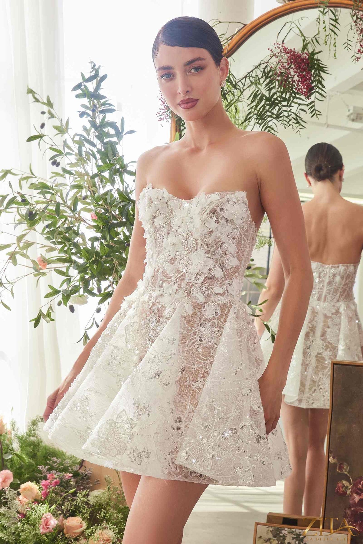 Off-white nude bridal mini A-line dress with floral appliqué by Zita La Belle Elite, featuring delicate lace and elegant skirt.