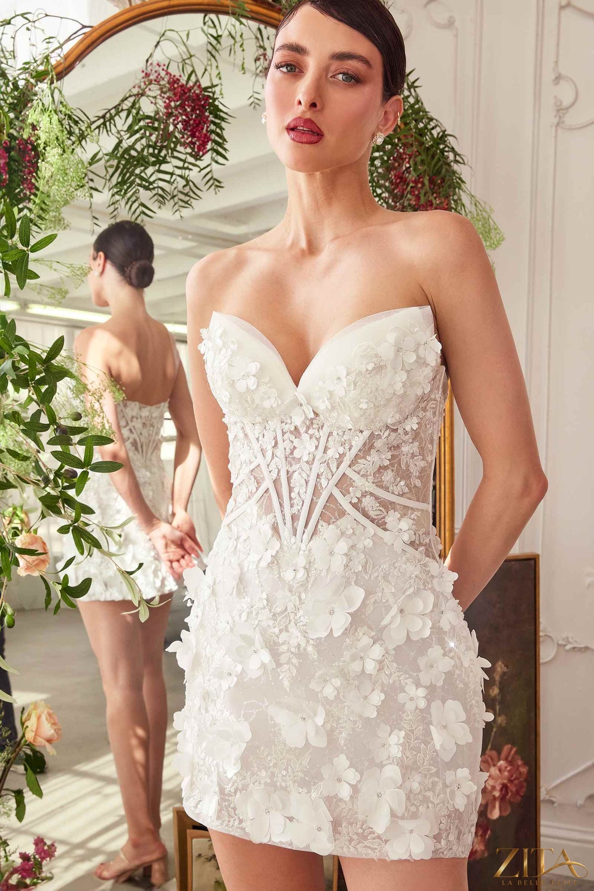 Off-white strapless midi bridal dress by Zita La Belle Elite featuring a deep sweetheart neckline and elegant short silhouette.
