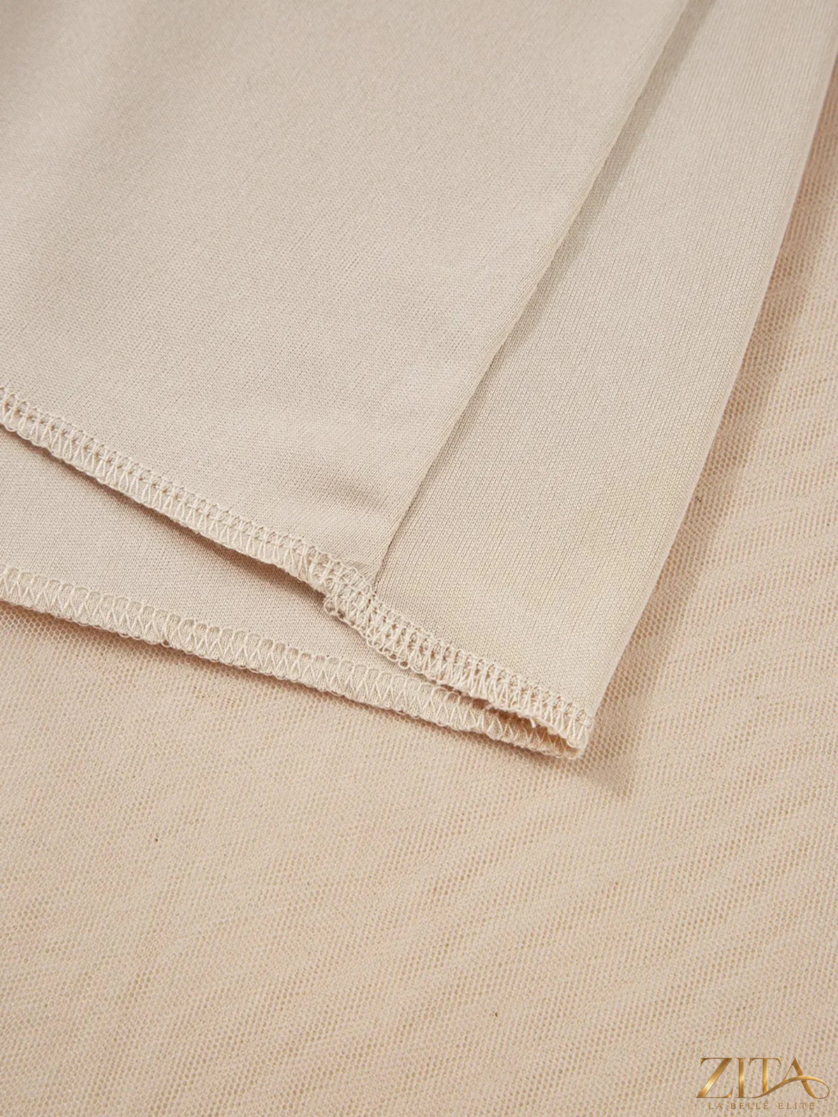 High-waisted midi skirt from Trendsi, featuring a flowy design in a neutral color, shown on a model.